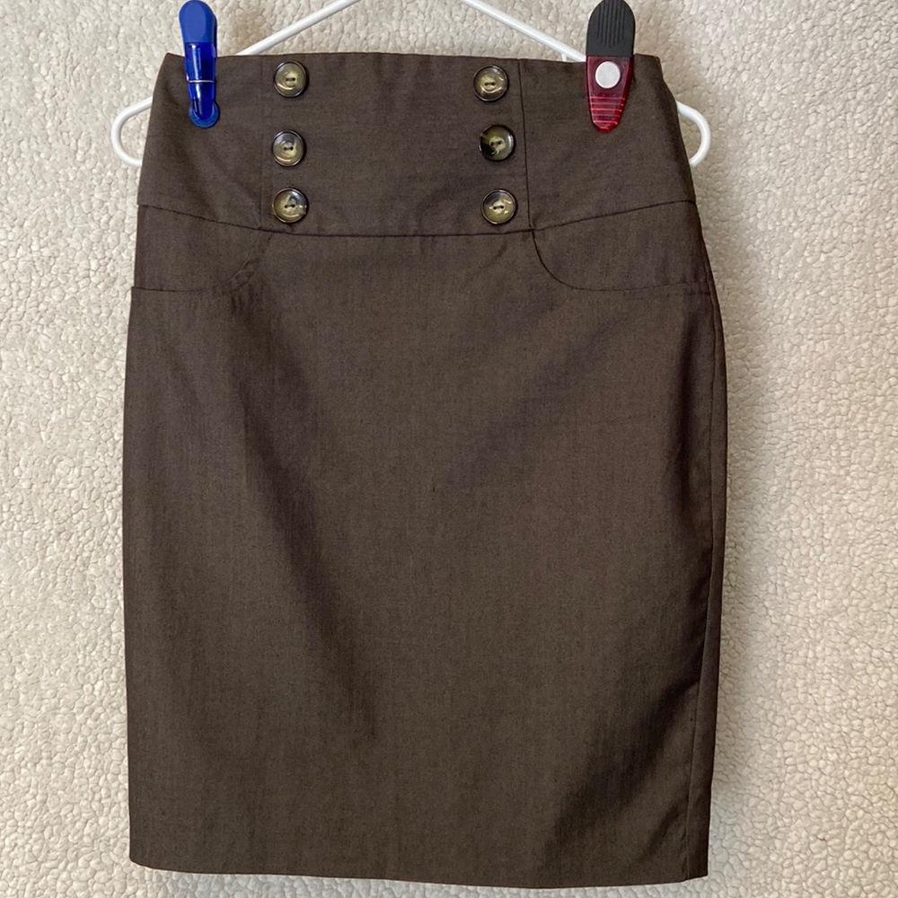 Beautiful skirt with big buttons as accents.
